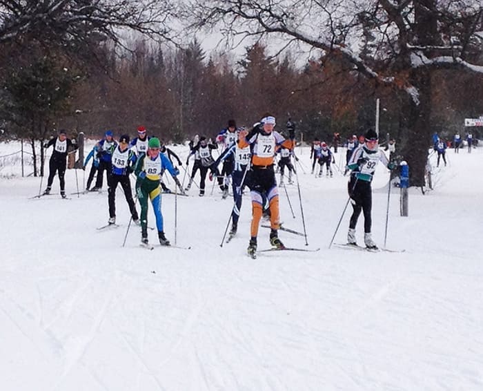 Kaitlyn leads out the women's race. She won the 13k race in 44: , (Photo credit: Curt Peterson)